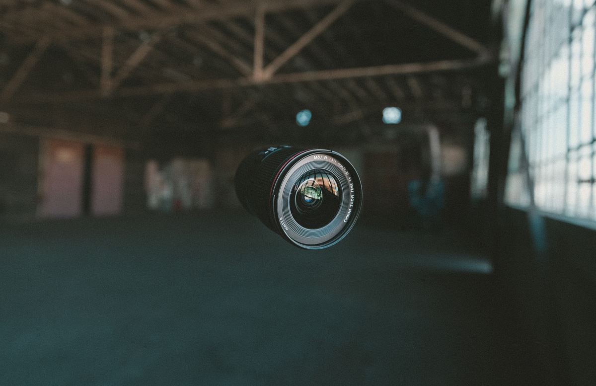 selective focus photography of black zoom lens on mid air